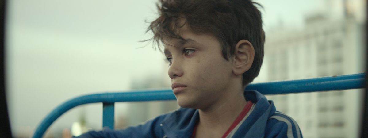 Film still: Zain has tears in his eyes