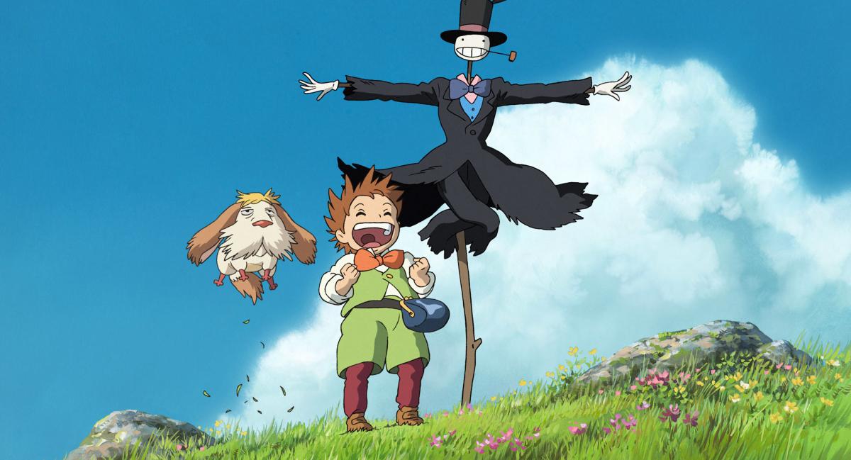 Film still: a scarecrow, a young boy and a dog smile and jump with glee