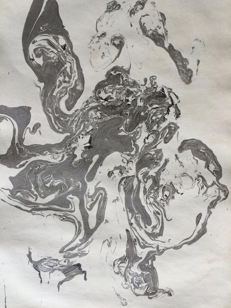 Black swirl of ink on paper
