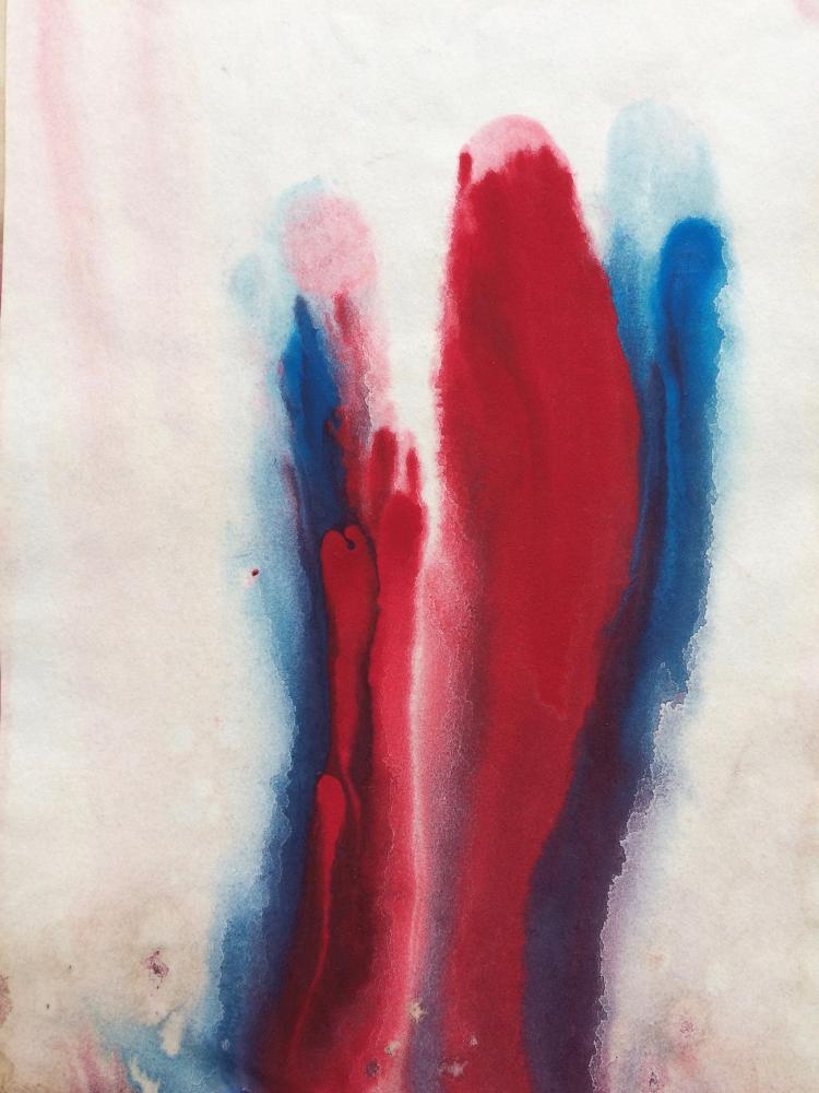 Red and blue paint running vertically down the paper