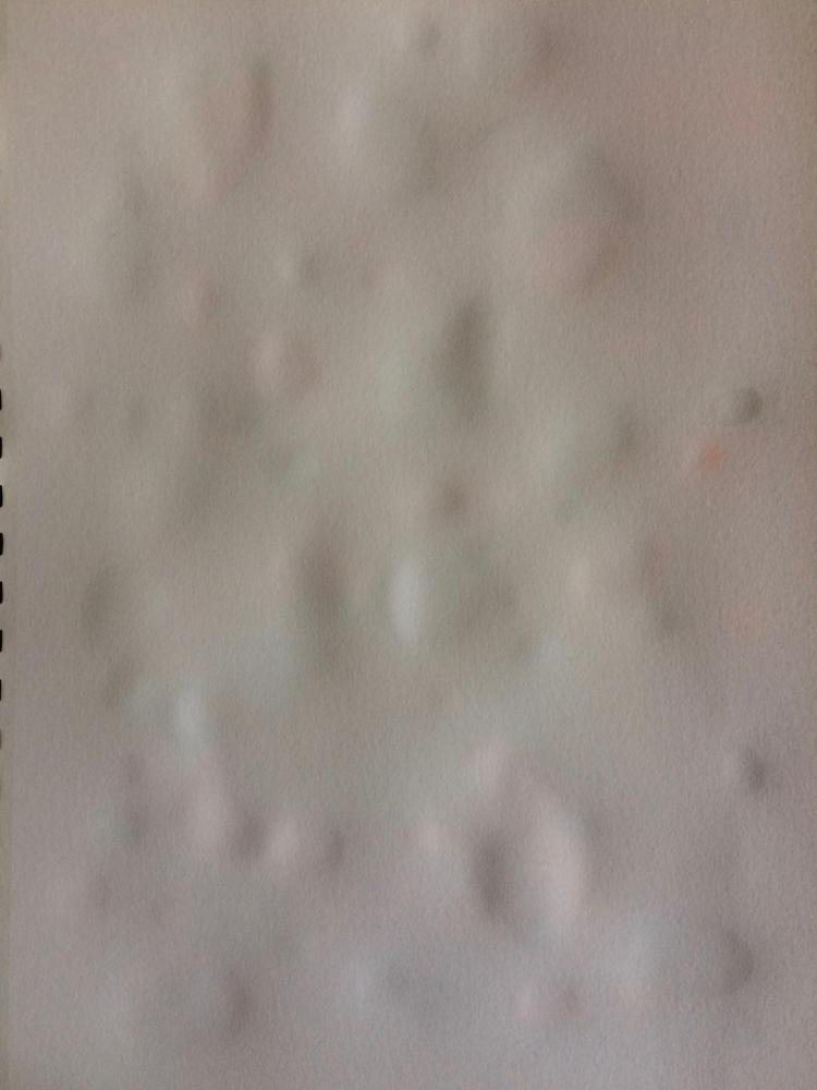 paper placed on top of paint droplets