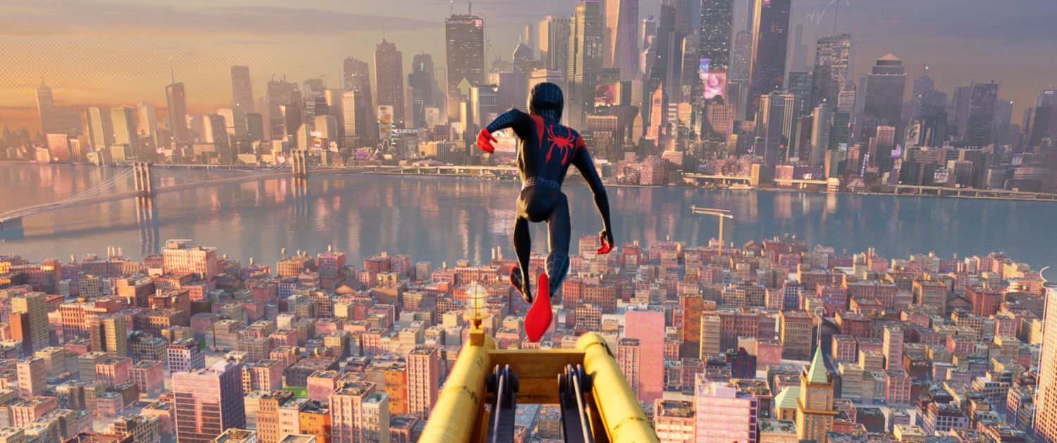 Film still: Miles Morales is Spider-Man as he launches himself above New York City