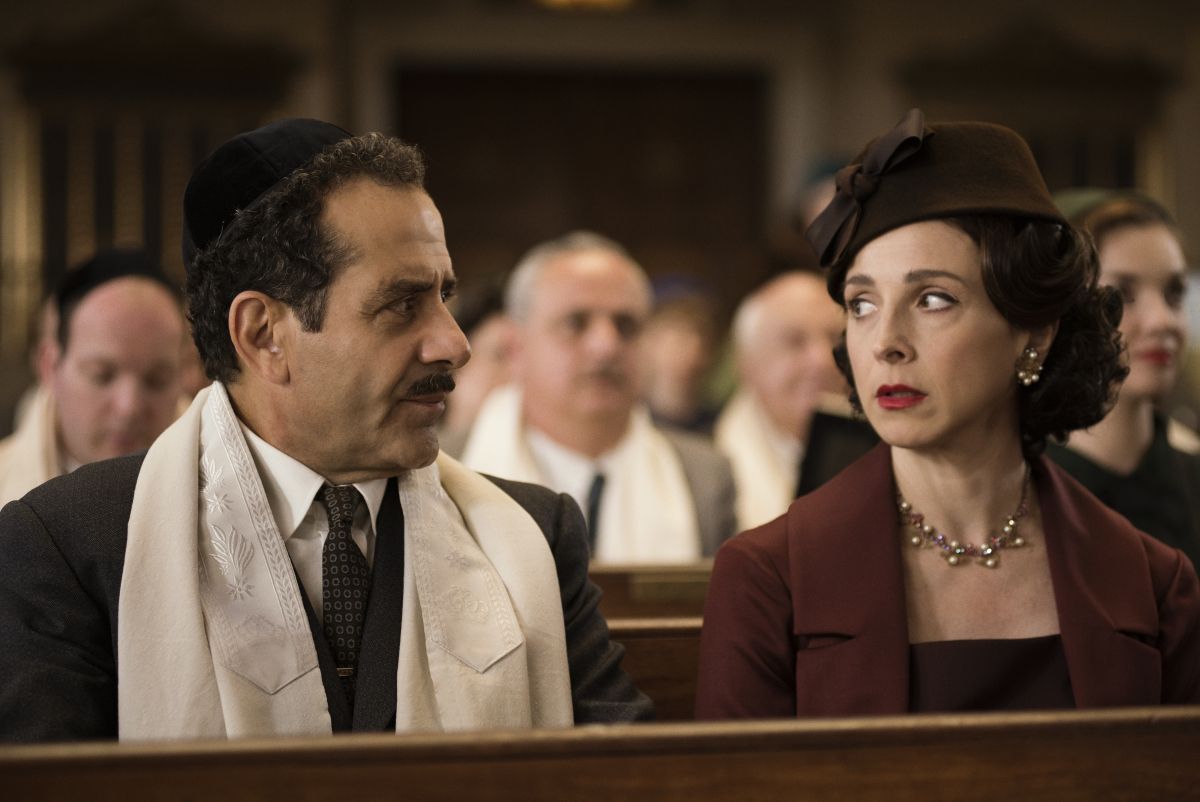 Film still: showing Mrs Maisel's parents looking at each other in a synagogue