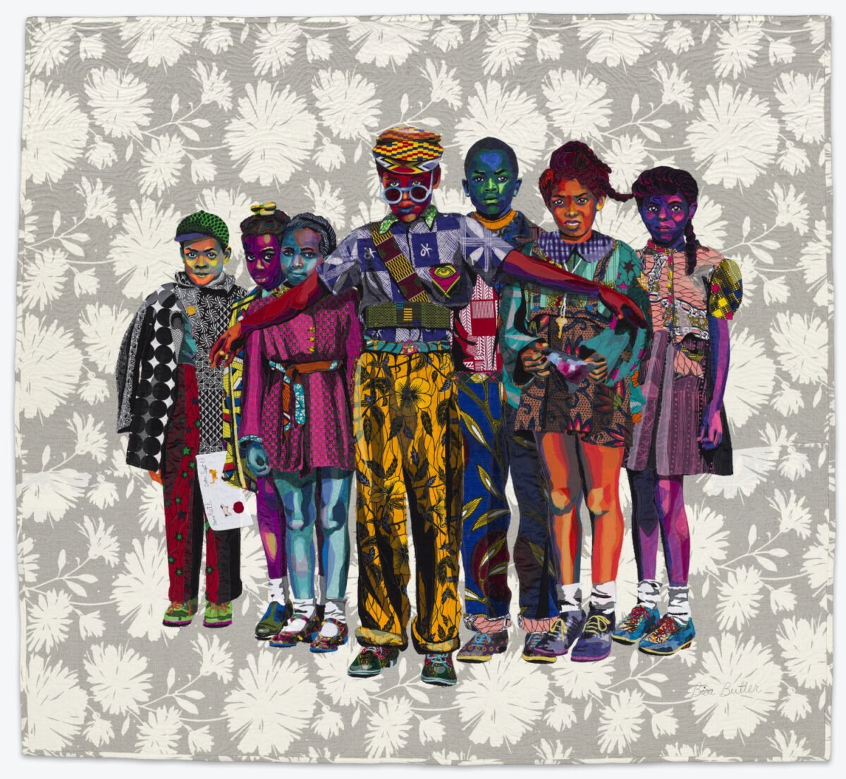 Textile image: 7 children stand looking forward, the child in the middle has their arms stretched out guarding those behind him.