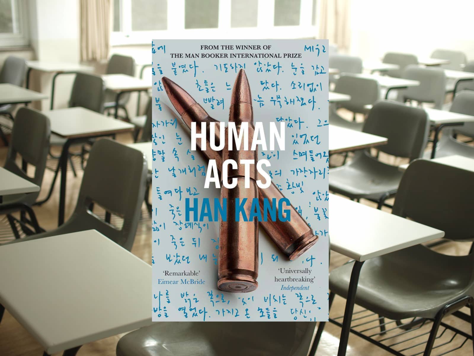 Book cover showing two bullets and Korean handwriting
