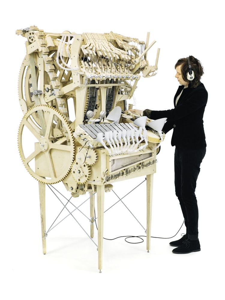 Photograph of Martin Molin playing the marble machine