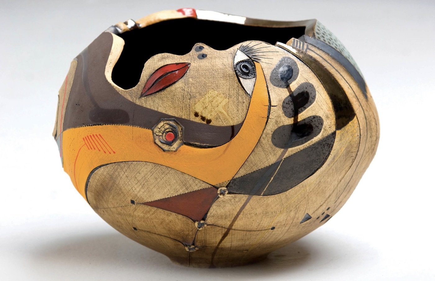 Bowl shaped vase, with strong inspirations to the artist Picasso while infused with a celebration of Africa