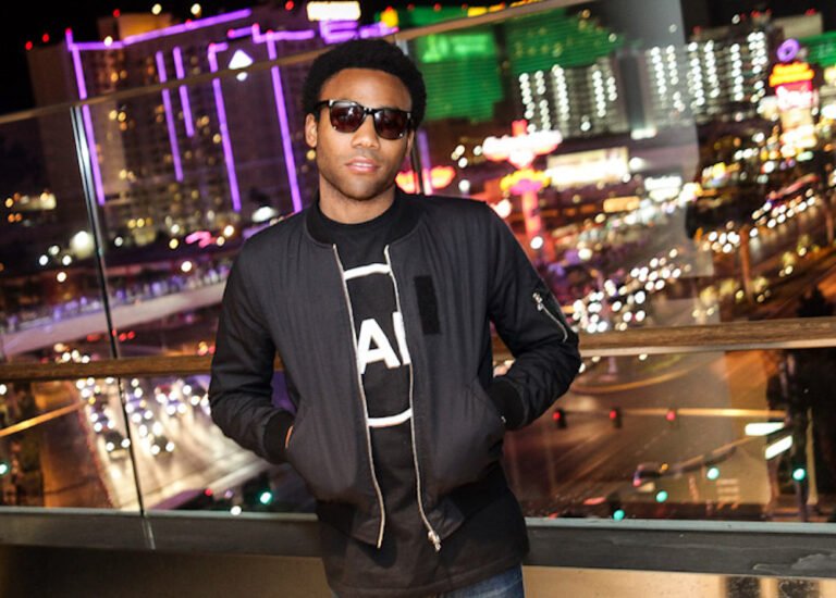 Photograph: Childish Gambino poses in front of the city lights of Las Vegas.