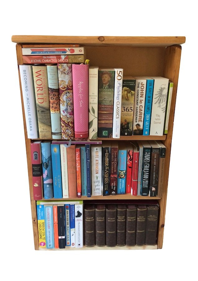 Photograph of the complete bookcase filled with books.