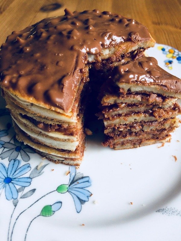 Stack of pancakes with layers of chocolate honeycomb
