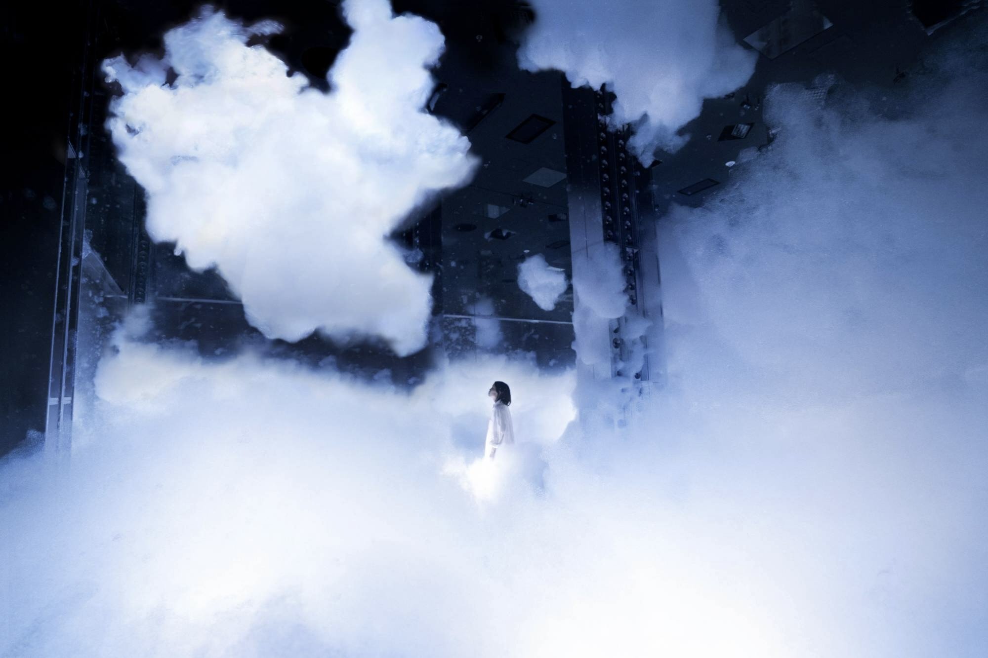 Installation: A large cavernous room fills with "clouds" made of foam.