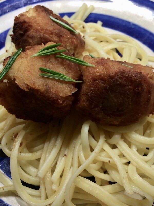 Tuna-cheese meatballs on a bed of linguine